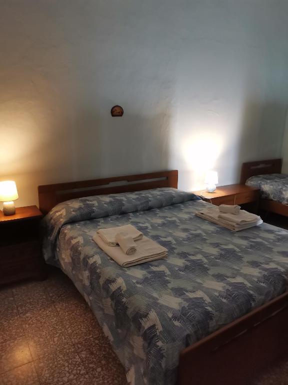 Łóżko lub łóżka w pokoju w obiekcie domus Verde