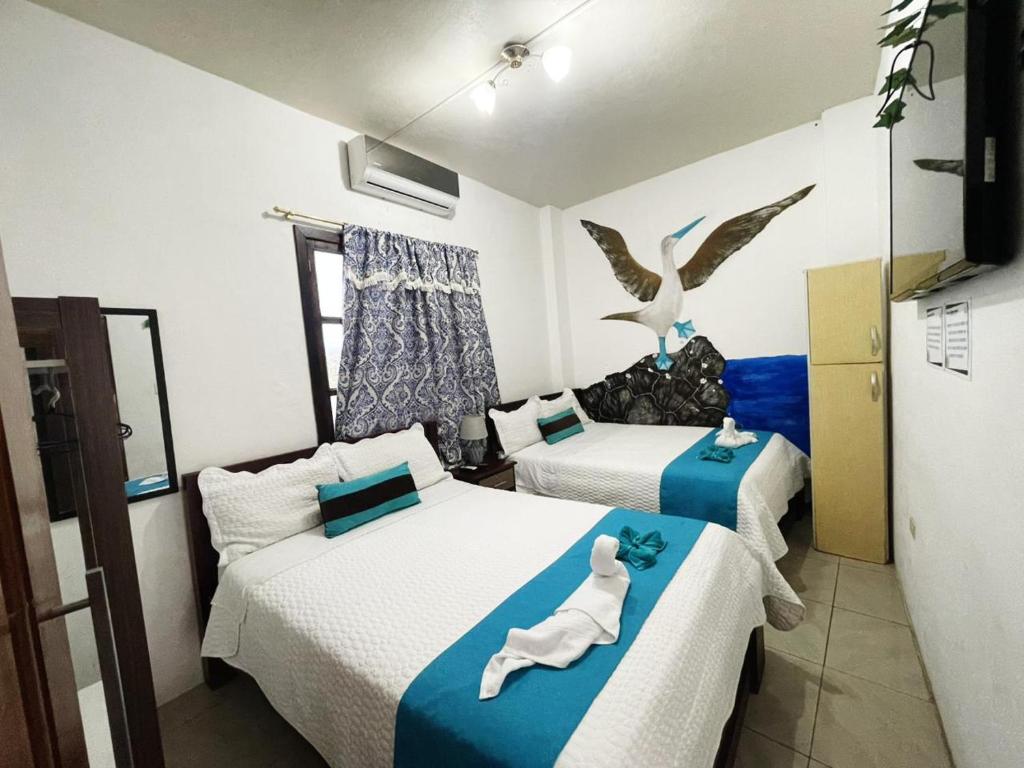 Postel nebo postele na pokoji v ubytování Suite Galarous Island