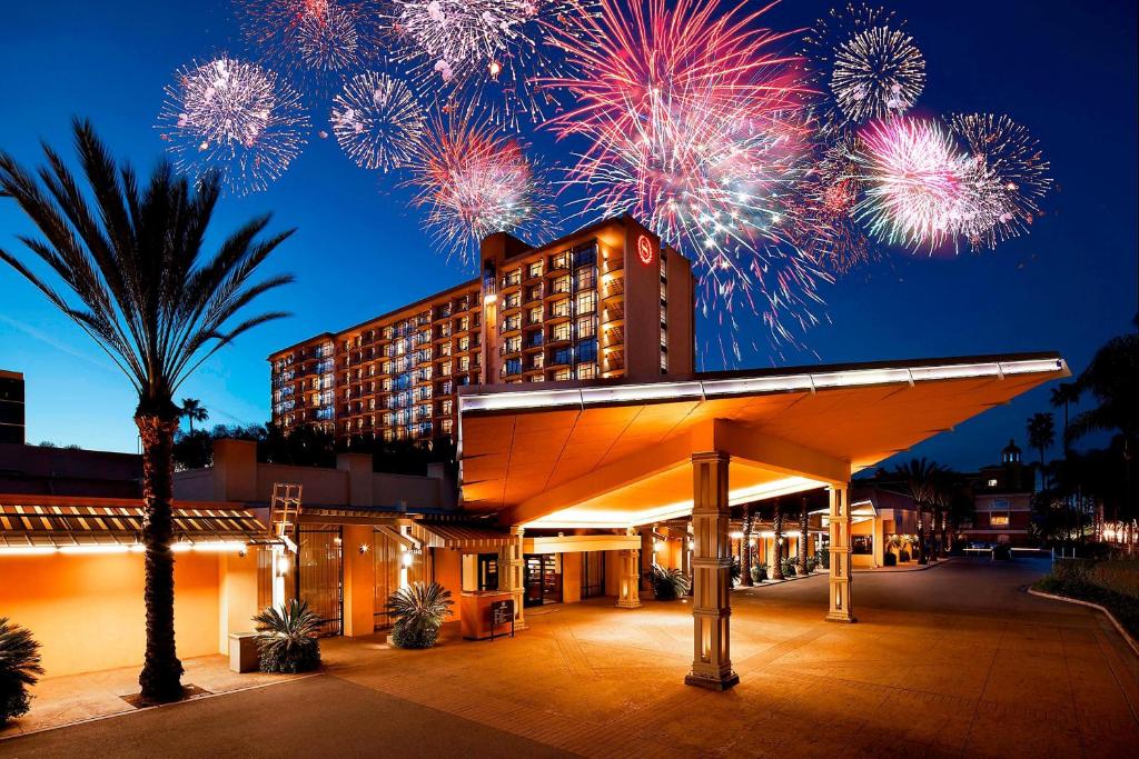 a hotel with fireworks exploding in the sky at Sheraton Park Hotel at the Anaheim Resort in Anaheim