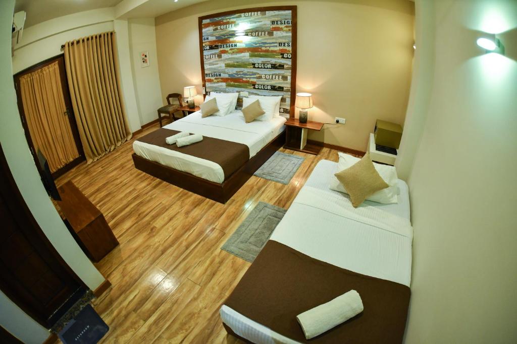 Postel nebo postele na pokoji v ubytování Hiriketiya Beach Resort