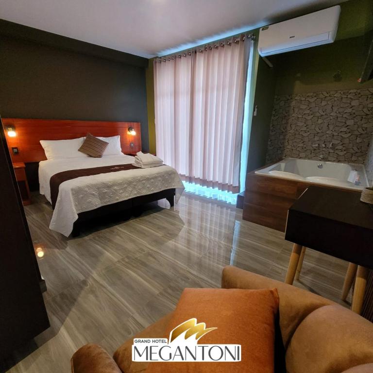 Postel nebo postele na pokoji v ubytování Grand Hotel Megantoni