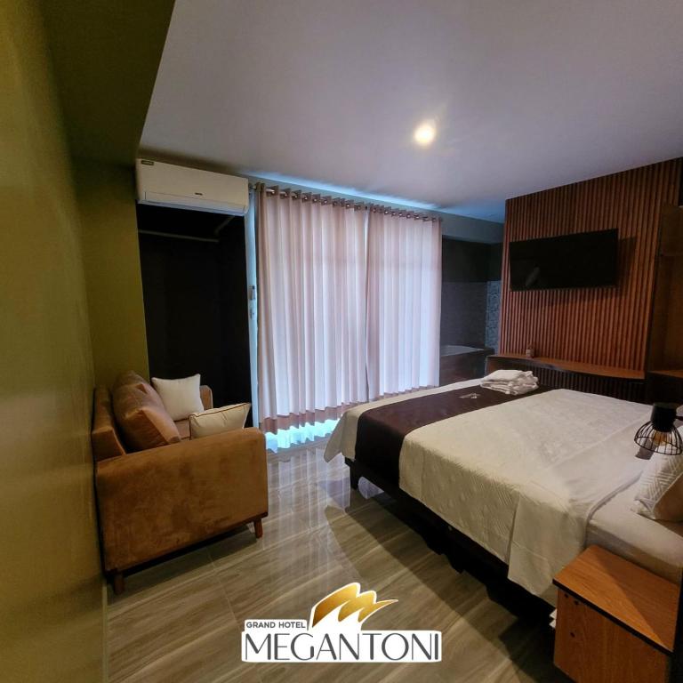 Postel nebo postele na pokoji v ubytování Grand Hotel Megantoni