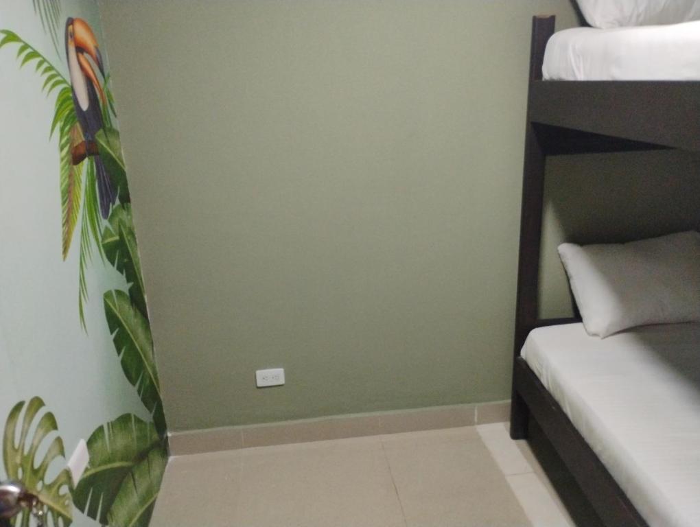 Letto o letti in una camera di Parceros Med Hostel