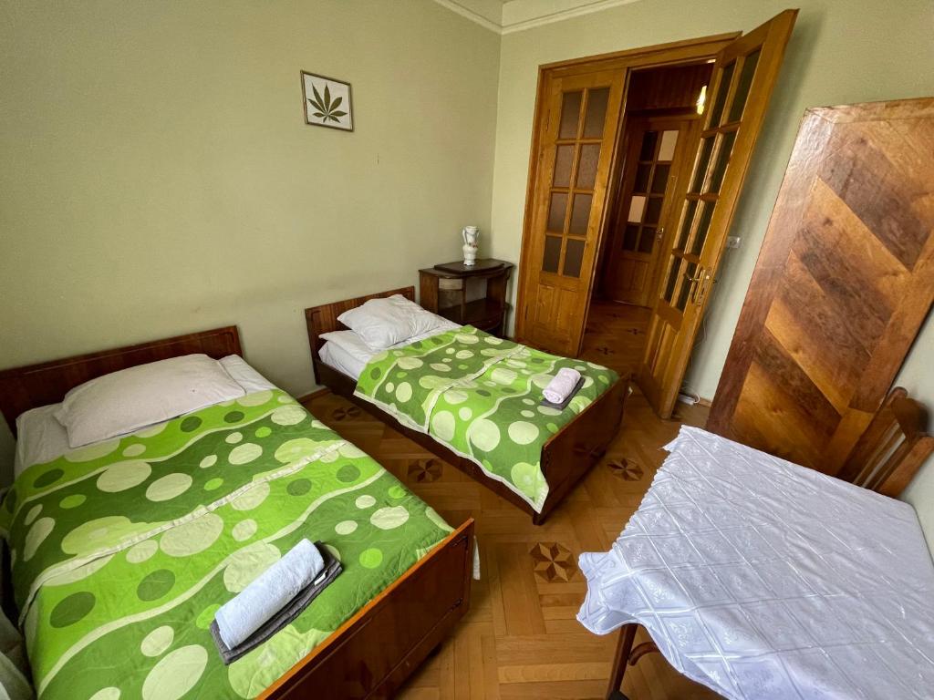 Postel nebo postele na pokoji v ubytování GuestHouse Sagarejo