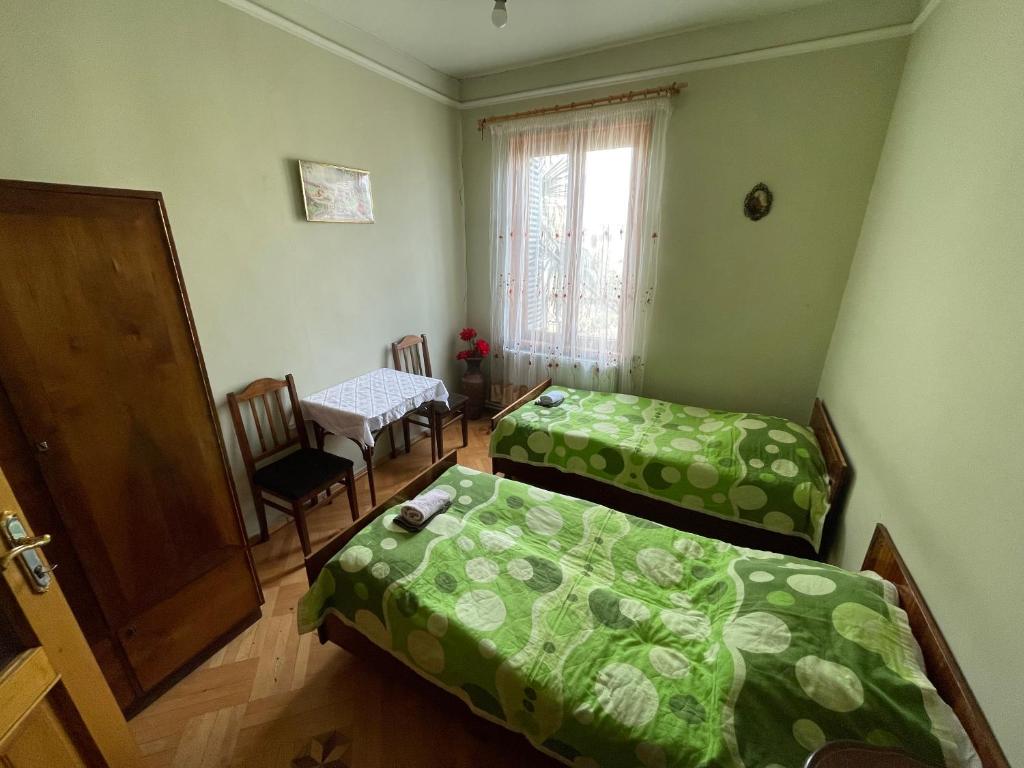 Postel nebo postele na pokoji v ubytování GuestHouse Sagarejo