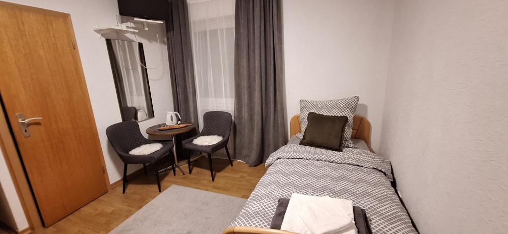 Postel nebo postele na pokoji v ubytování Haus Sissi
