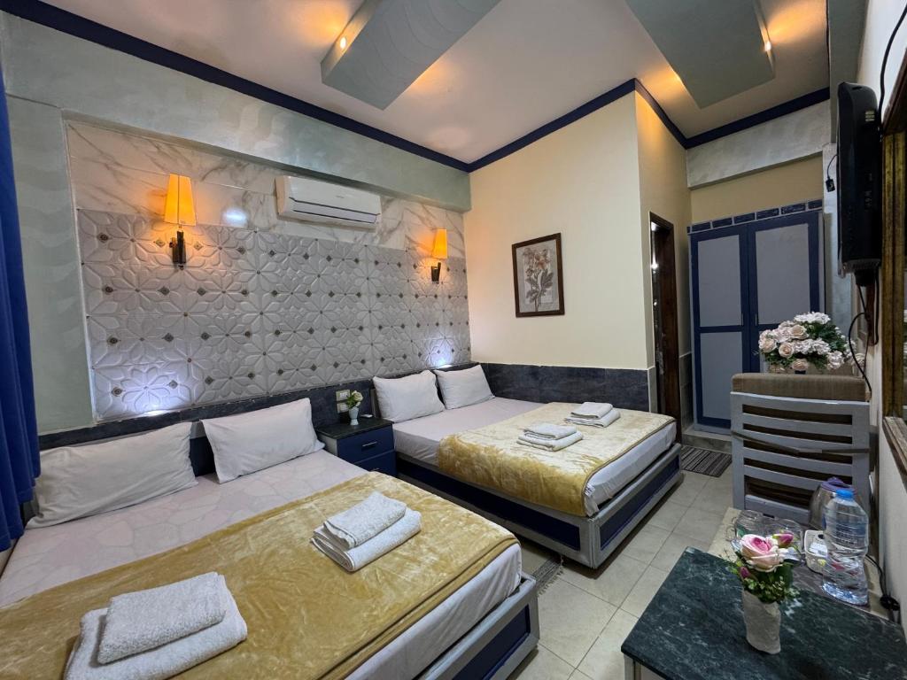 Postel nebo postele na pokoji v ubytování Sababa Hotel