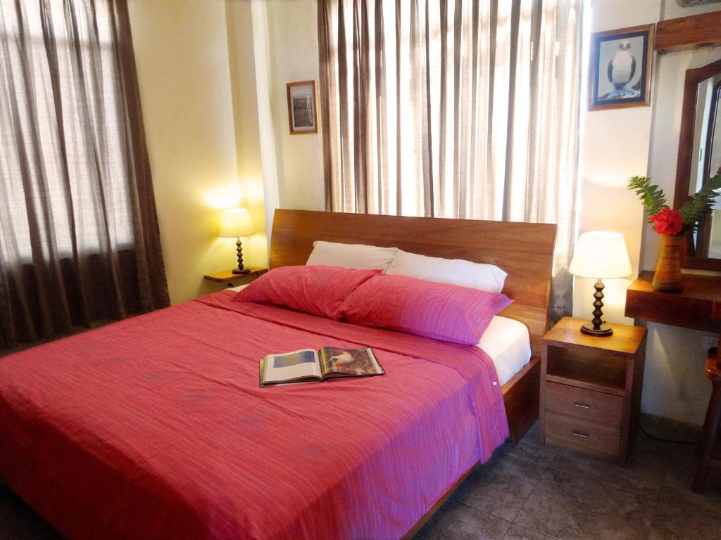 Postel nebo postele na pokoji v ubytování Hotel Del Sol Galapagos