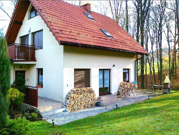 a large white house with a red roof at Rychwałd - Full House! in Rychwałd
