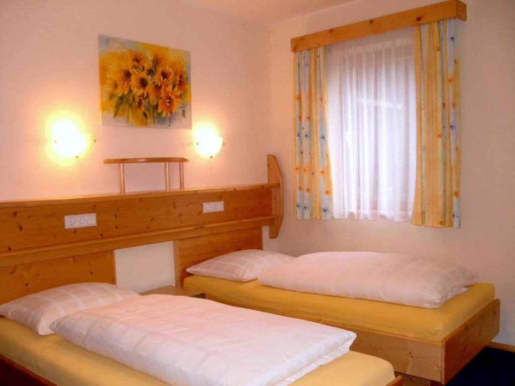 Postel nebo postele na pokoji v ubytování Gasthof Post