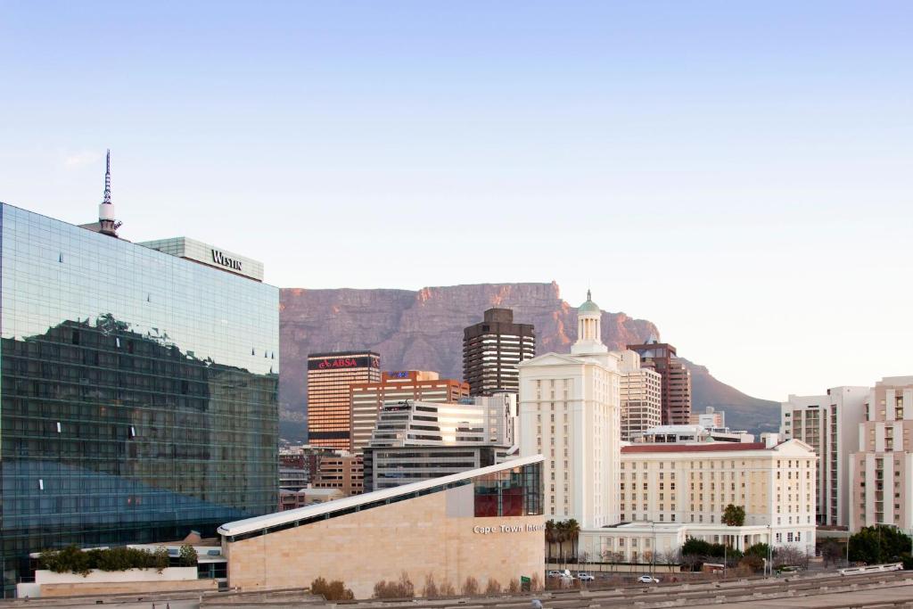 a view of a city with a mountain in the background at The Westin Cape Town in Cape Town