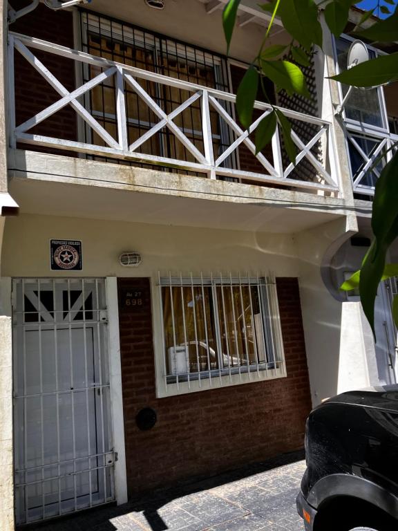 a building with bars on the front of it at DuplexNico in Santa Teresita