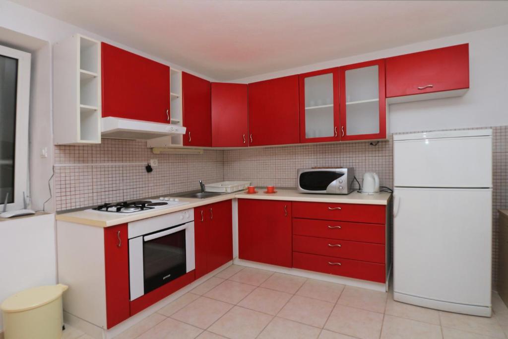 Kuchyň nebo kuchyňský kout v ubytování Apartments Andrijašević