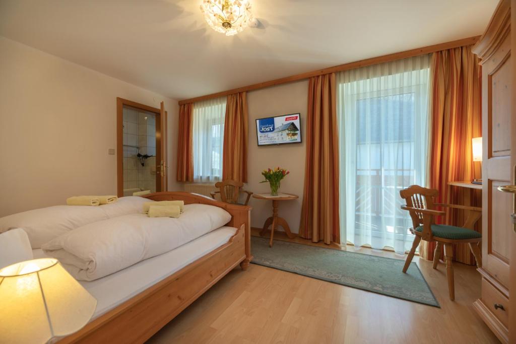 Postel nebo postele na pokoji v ubytování Appartement Jost - Nassfeld