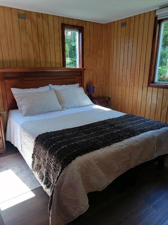Postel nebo postele na pokoji v ubytování Cabañas CyG - Chaitén