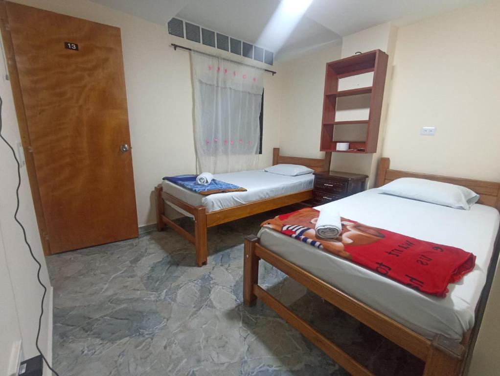 Postel nebo postele na pokoji v ubytování Hotel San Vicente