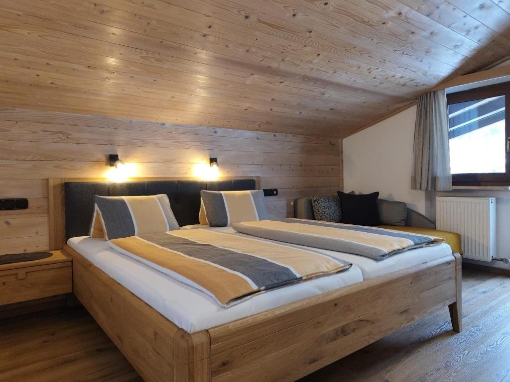 Postel nebo postele na pokoji v ubytování Gästehaus Midi