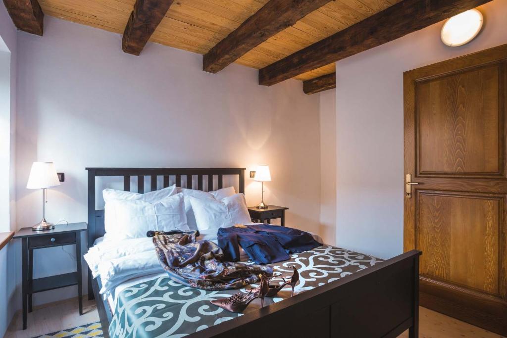 Postel nebo postele na pokoji v ubytování Portole Suites