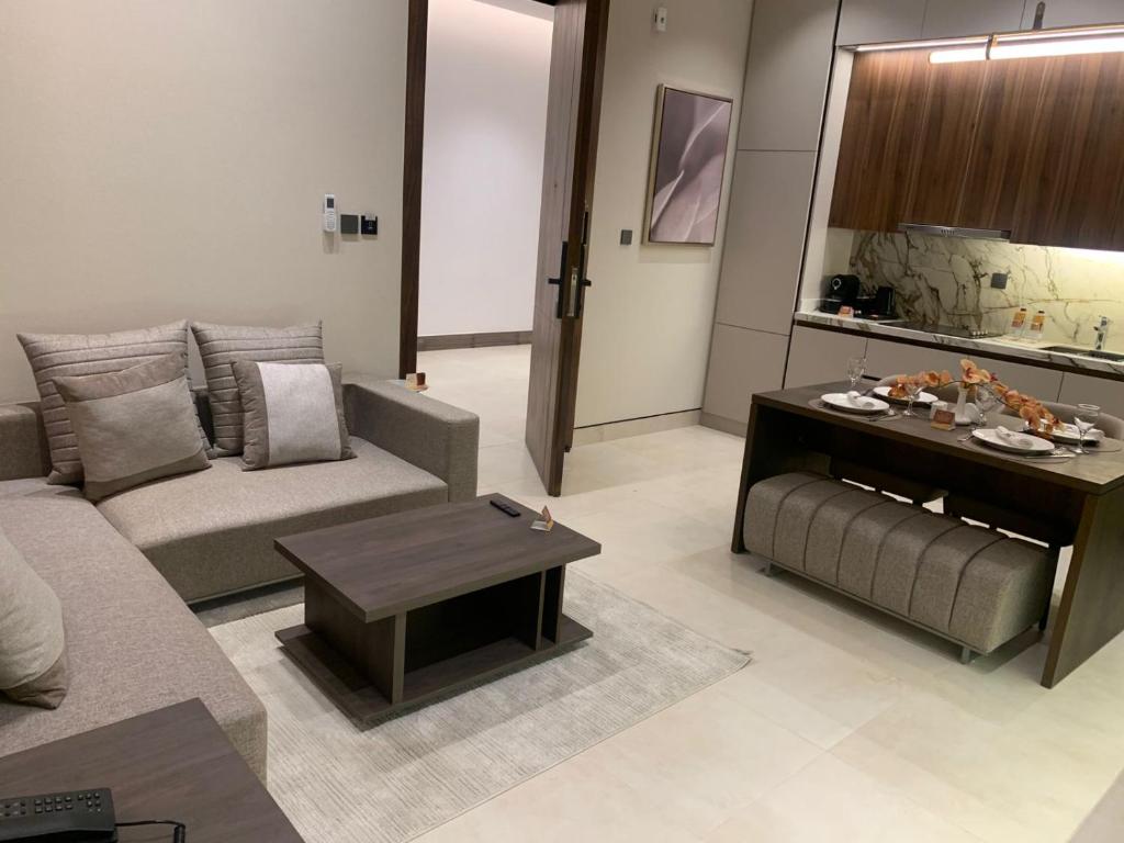 a living room with a couch and a table at فندق ليورا Liora Hotel in Riyadh