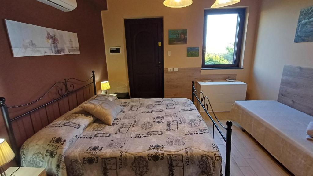 Posteľ alebo postele v izbe v ubytovaní Profumo di Zagara Acireale