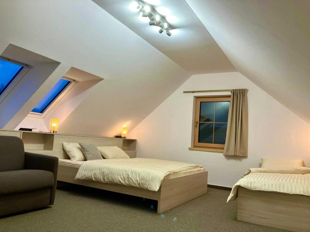 Postel nebo postele na pokoji v ubytování Apartmány Roháče