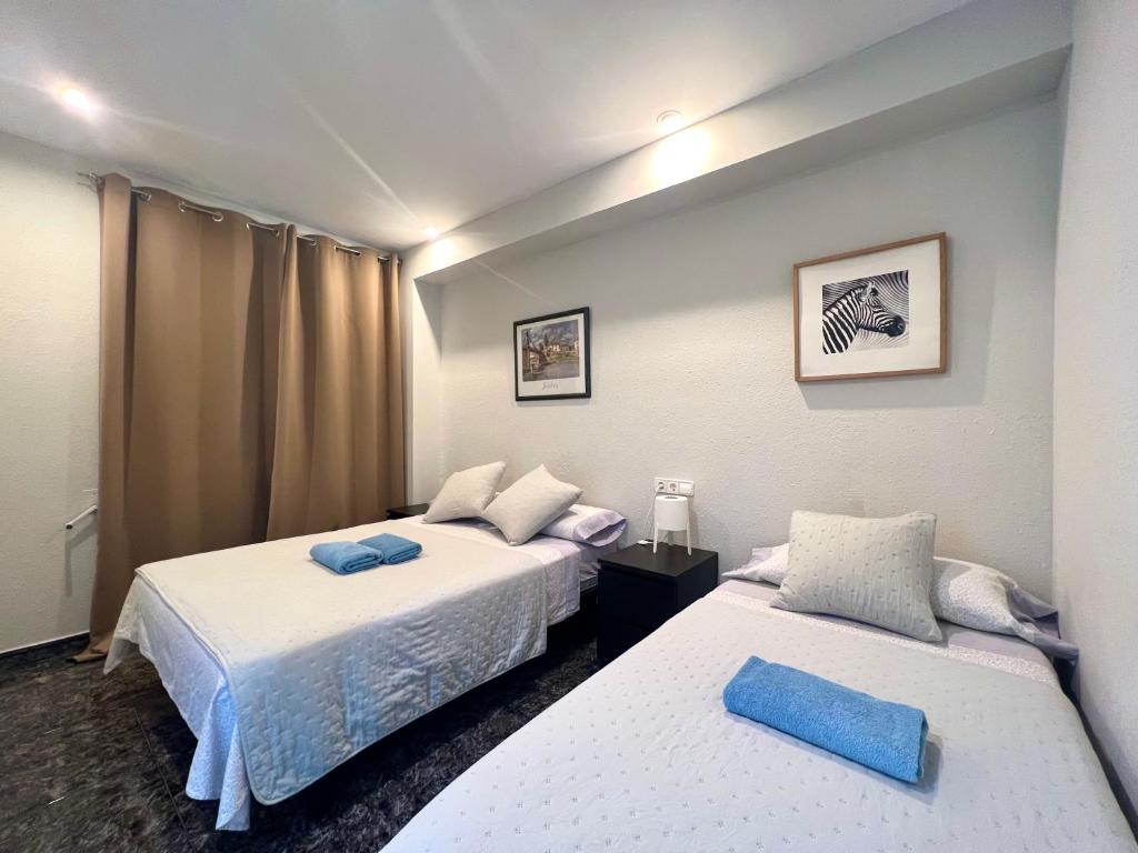 Postel nebo postele na pokoji v ubytování Apartamentos Playa