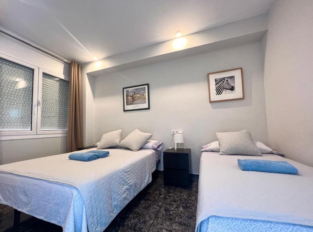 Postel nebo postele na pokoji v ubytování Apartamentos Playa