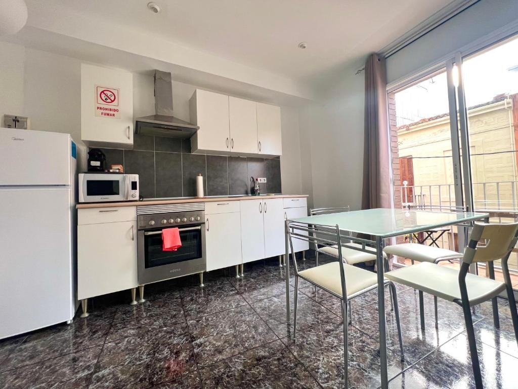 Kuchyň nebo kuchyňský kout v ubytování Apartamentos Playa