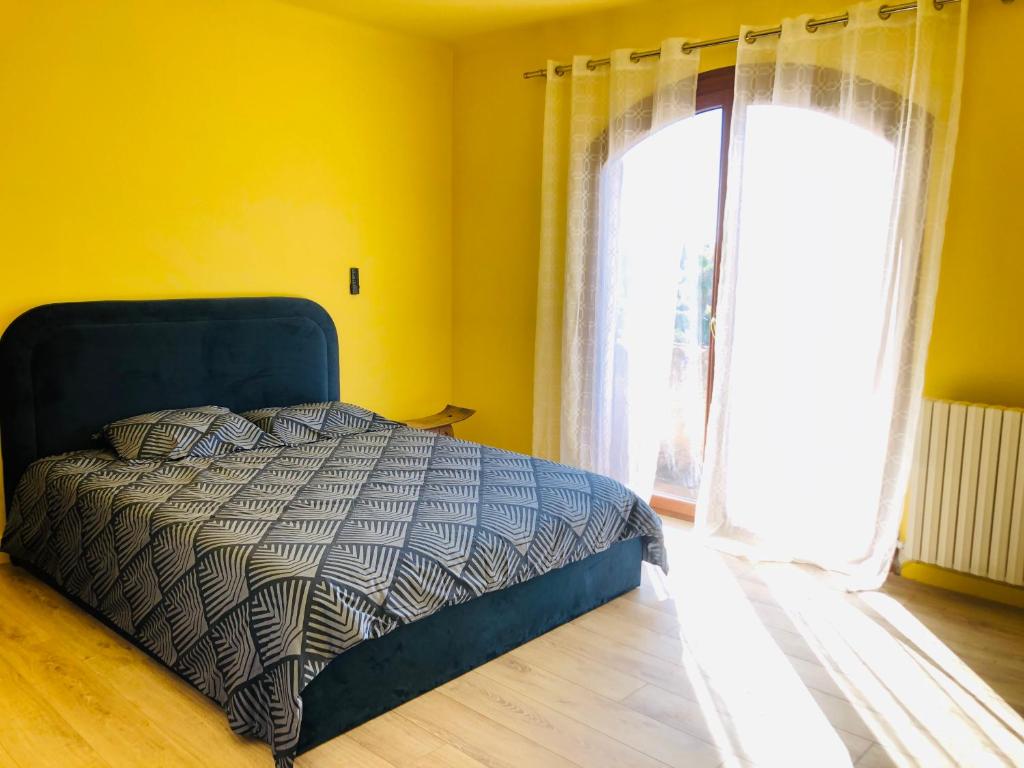 Postel nebo postele na pokoji v ubytování Casa Scaglione - camara giallu