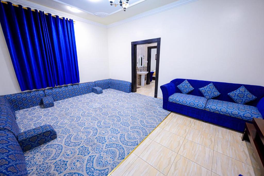 Postel nebo postele na pokoji v ubytování منازل الرؤية الفندقية