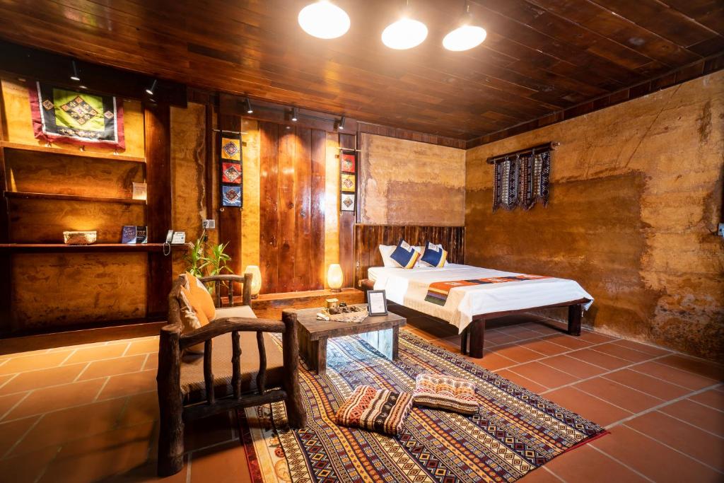 Postel nebo postele na pokoji v ubytování H'mong Village Resort Ha Giang