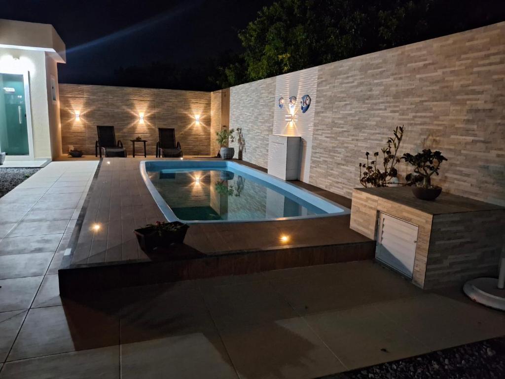 Swimmingpoolen hos eller tæt på Espaço de descanso e paz