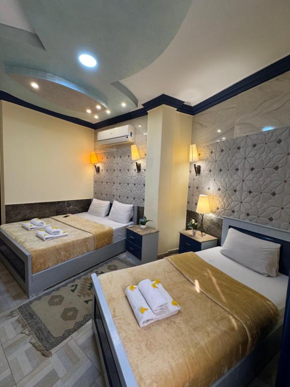 Postel nebo postele na pokoji v ubytování Sababa Hotel
