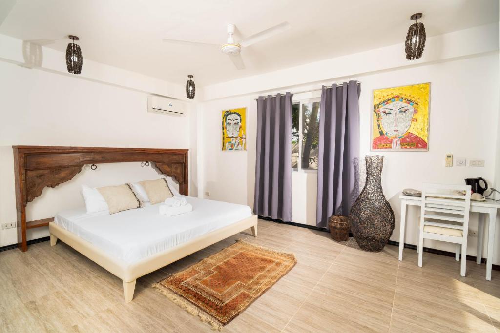 Postel nebo postele na pokoji v ubytování Blanco Beach Resort Malapascua