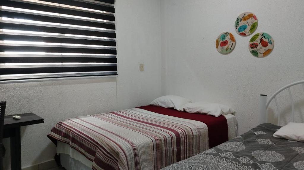 Postel nebo postele na pokoji v ubytování Stefanich Aparthotel 51