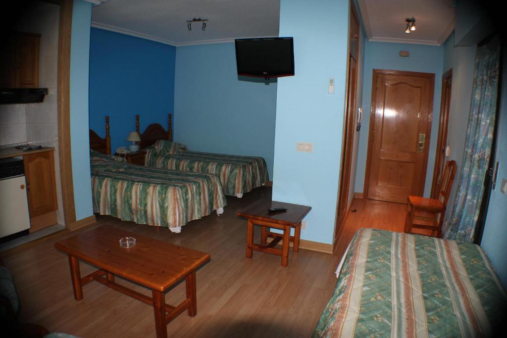 Postel nebo postele na pokoji v ubytování Hotel Las Nieves