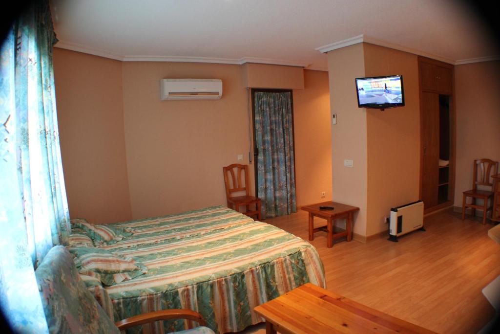 Postel nebo postele na pokoji v ubytování Hotel Las Nieves