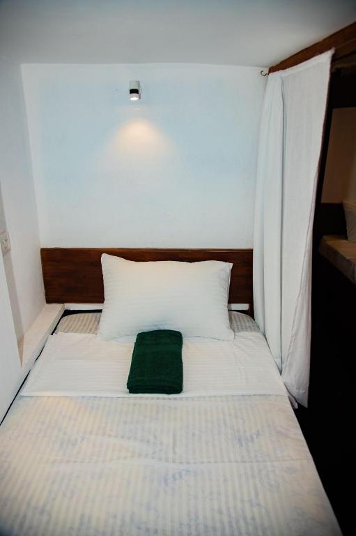 Postel nebo postele na pokoji v ubytování New Radiant Hostal
