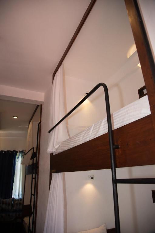 Postel nebo postele na pokoji v ubytování New Radiant Hostal