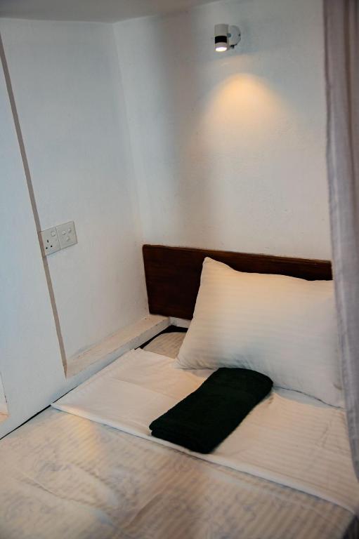 Postel nebo postele na pokoji v ubytování New Radiant Hostal