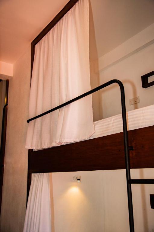 Postel nebo postele na pokoji v ubytování New Radiant Hostal