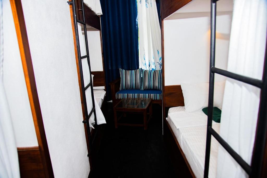 Postel nebo postele na pokoji v ubytování New Radiant Hostal