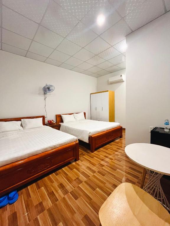 Postel nebo postele na pokoji v ubytování Bình Minh Homestay - Dốc Lết