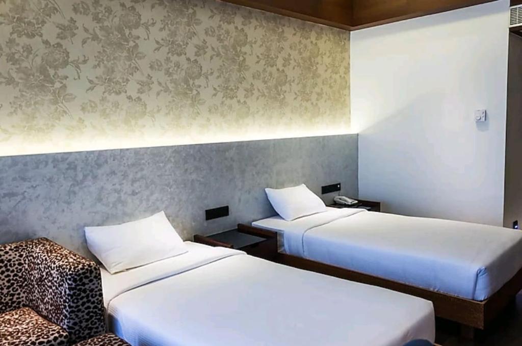 Postel nebo postele na pokoji v ubytování Diana Heights Luxury Hotel