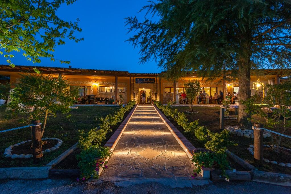 a building with a walkway in front of it at Agriturismo Quartuccio in Oricola