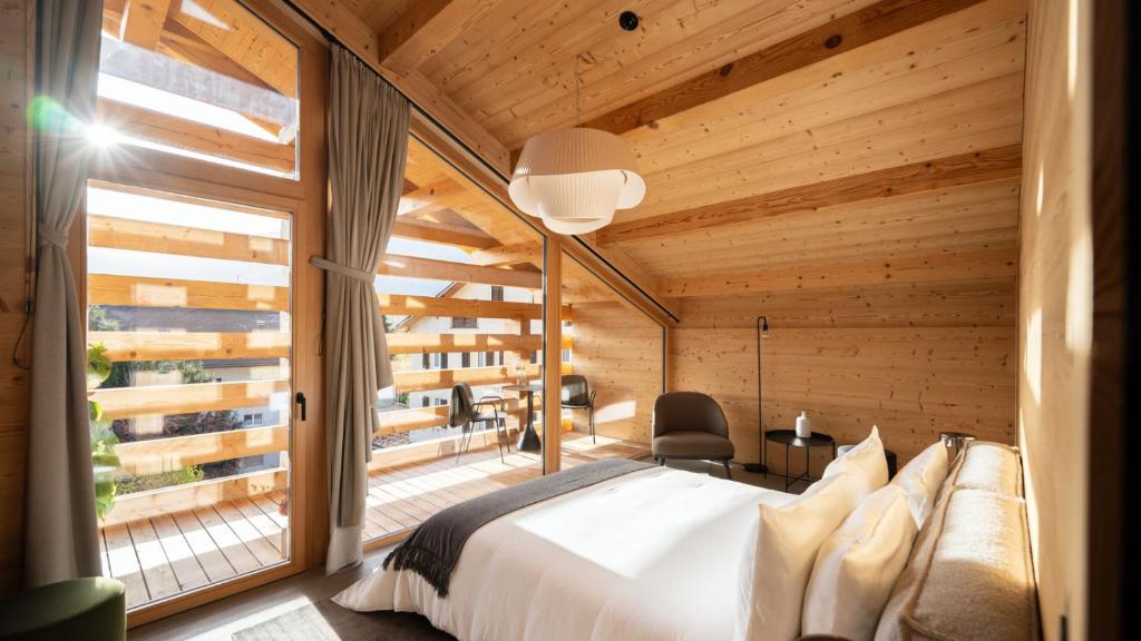 Postel nebo postele na pokoji v ubytování Boutique Hotel Casa Giovanoli