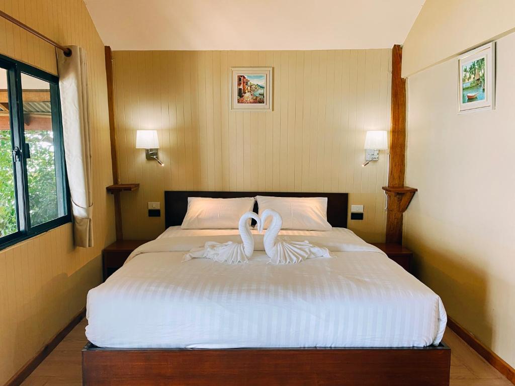 Postel nebo postele na pokoji v ubytování Velora Bay Koh Jum