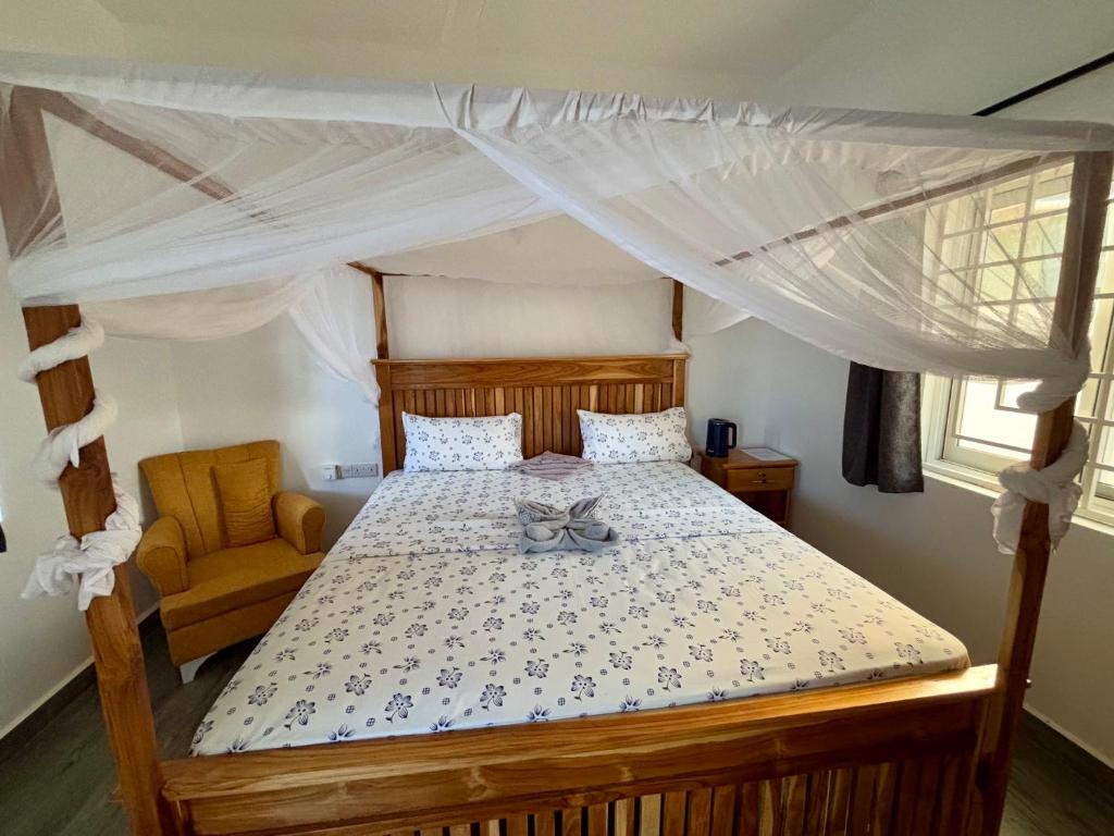 Postel nebo postele na pokoji v ubytování ZMK Hotel