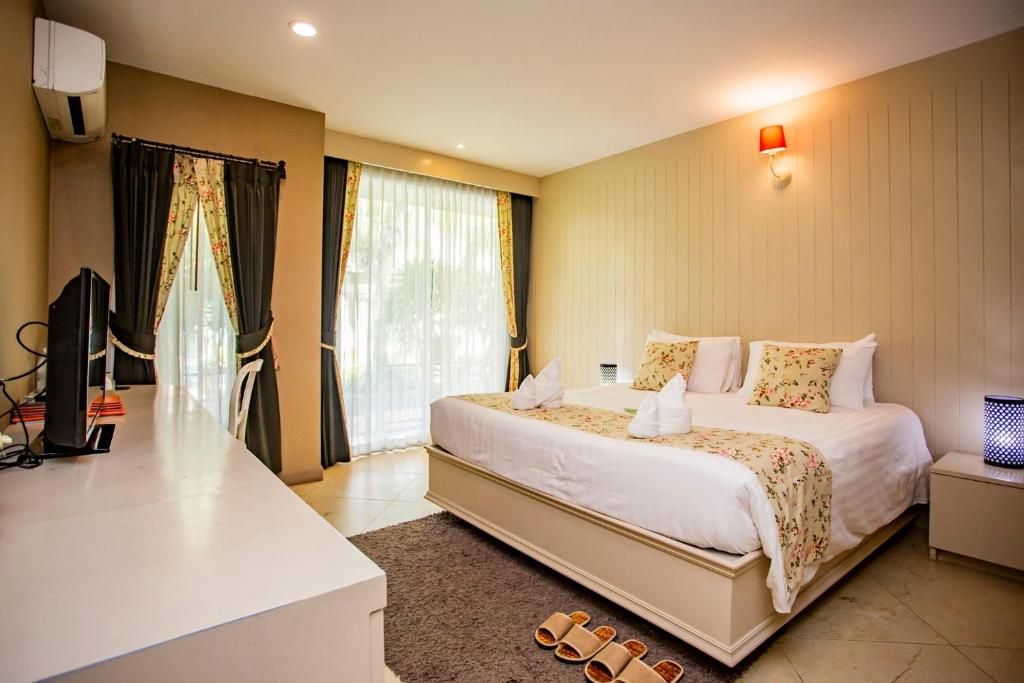 Postel nebo postele na pokoji v ubytování La Villa Boutique hotel