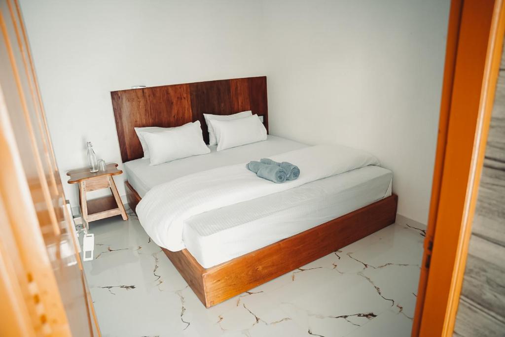 Postel nebo postele na pokoji v ubytování Kuma Surf House